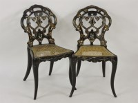 Lot 647 - A pair of Victorian ebonised bedroom chairs