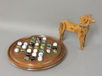 Lot 295 - A wooden board with various marbles