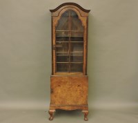 Lot 678 - A Queen Anne style walnut display cabinet