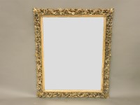 Lot 584 - A large Florentine carved and gilt wall mirror