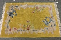 Lot 709 - A Chinese yellow ground rug