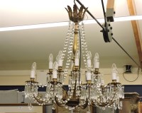 Lot 632 - An early 20th century nine branch chandelier