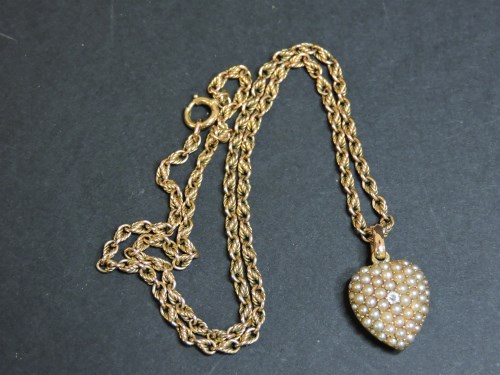 Lot 72 - A diamond and split pearl heart pendant and chain