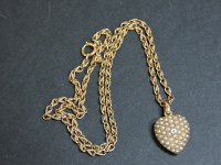 Lot 72A - A diamond and split pearl heart pendant and chain