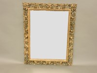 Lot 704 - A Florentine carved and gilt wall mirror