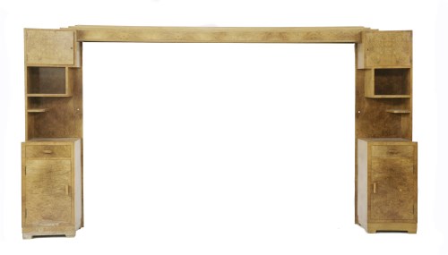 Lot 224 - An Art Deco walnut integral headboard