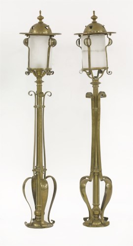 Lot 45 - A pair of Scottish Arts & Crafts brass newel post lamps