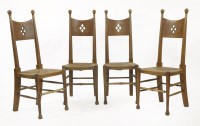 Lot 55 - A set of four Arts and Crafts oak chairs