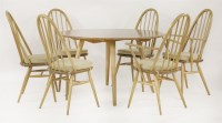 Lot 554 - An Ercol ash drop-leaf table