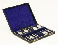 Lot 75 - A set of six silver Liberty & Co. teaspoons and a sugar tong
