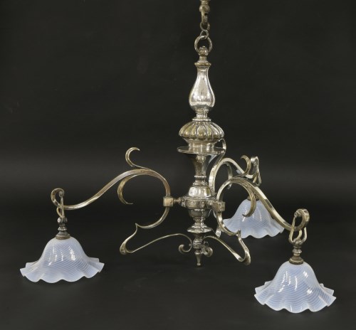 Lot 105 - An Arts and Crafts plated brass three-branch chandelier