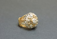 Lot 1 - A yellow and white gold diamond cluster ring
