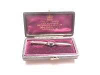 Lot 37 - An Art Deco sapphire and diamond bar brooch
