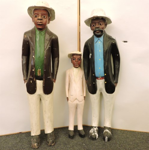 Lot 560 - Three South African carved wood and painted figures