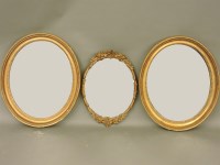 Lot 713 - A pair of oval gilt mirrors