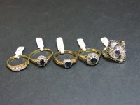 Lot 18 - A 14ct gold sapphire and diamond marquise shaped cluster ring