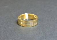Lot 11 - An 18ct yellow and white gold wedding ring