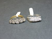 Lot 15 - Two 18ct gold five stone diamond rings