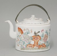 Lot 558 - A famille rose teapot and cover