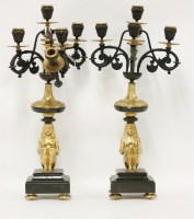 Lot 1120 - A late 19th century pair of gilt metal and cast iron five-light table candelabra