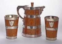 Lot 79 - A Victorian oak beer jug with silver-plated mounts