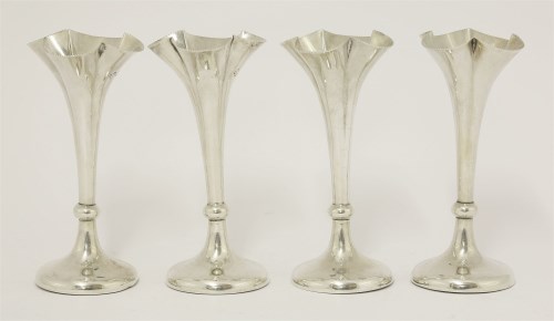Lot 136 - A set of four Edwardian silver flower vases