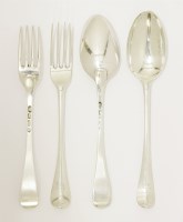 Lot 41 - A set of six 18th century Dutch silver hanoverian pattern tablespoons and eleven four prong table forks en suite