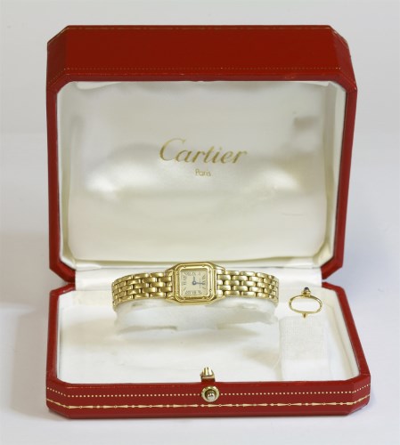 Lot 528 - A ladies' 18ct gold Cartier mini Panthere bracelet watch