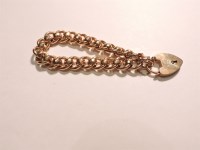 Lot 63 - A curb and faceted belcher link chain bracelet