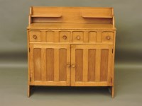 Lot 699 - A 'Heals type light oak sideboard