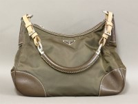 Lot 219 - A Prada brown leather and canvas handbag