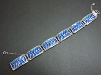 Lot 15 - A sterling silver enamel waves bracelet