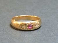 Lot 53 - A 15ct gold ruby and diamond three stone star set gypsy ring