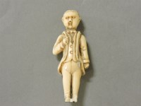 Lot 110 - A small carved ivory figure of a gentleman