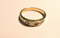 Lot 145 - A graduated sapphire and diamond half hoop ring