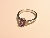 Lot 149 - An 18ct white gold three stone amethyst and diamond ring