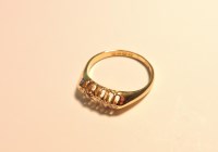 Lot 154 - An 18ct gold five stone diamond boat shaped ring