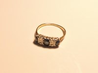 Lot 167 - A three stone sapphire ring