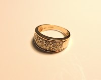 Lot 173 - A 9ct gold diamond set tapered band ring