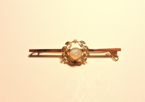 Lot 202 - An Edwardian opal and seed pearl wreath bar brooch