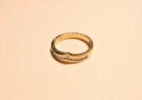 Lot 221 - An 18ct gold tapered baguette diamond half wishbone ring