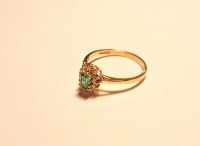 Lot 223 - An 18ct gold emerald and diamond rectangular cluster ring