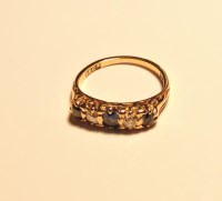 Lot 230 - A late Victorian sapphire and diamond five stone carved head ring