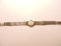 Lot 256 - A ladies 9ct gold Tissot mechanical bracelet watch