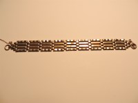 Lot 284 - A 9ct gold four row gate bracelet