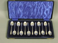 Lot 387 - A cased set of twelve silver coffee spoons