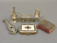 Lot 391 - A miniature white metal table