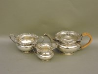 Lot 469 - A silver three piece teaset