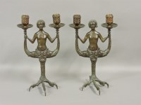 Lot 505 - A pair of bronze two branch candelabrum