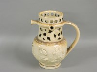 Lot 600 - A Derbyshire saltglaze brown stoneware puzzle jug